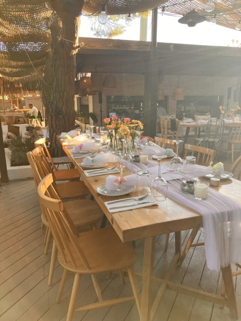 Wedding table setup at Melia Restaurant Vourvourou Halkidiki with flowers and ambient lighting