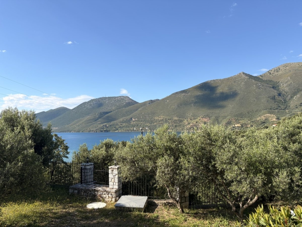 View of Skoutari bay, Mani, from above Chara Houses – olive trees, mountains and deep blue sea