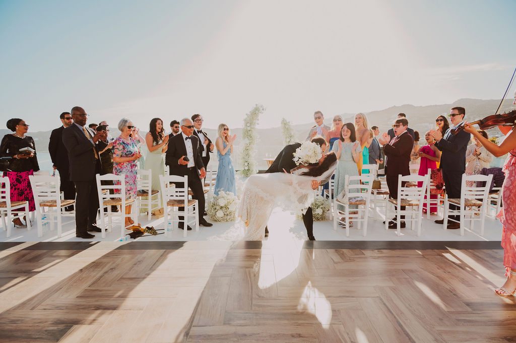 Mykonos destination wedding DJ – first kiss moment at Royal Myconian with live violin