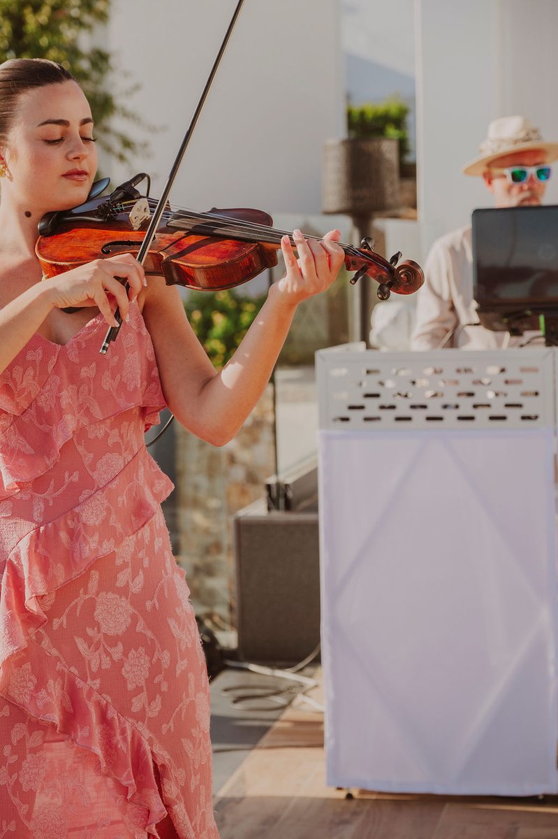 Live violin player with DJ Seitan at Mykonos destination wedding ceremony, Royal Myconian