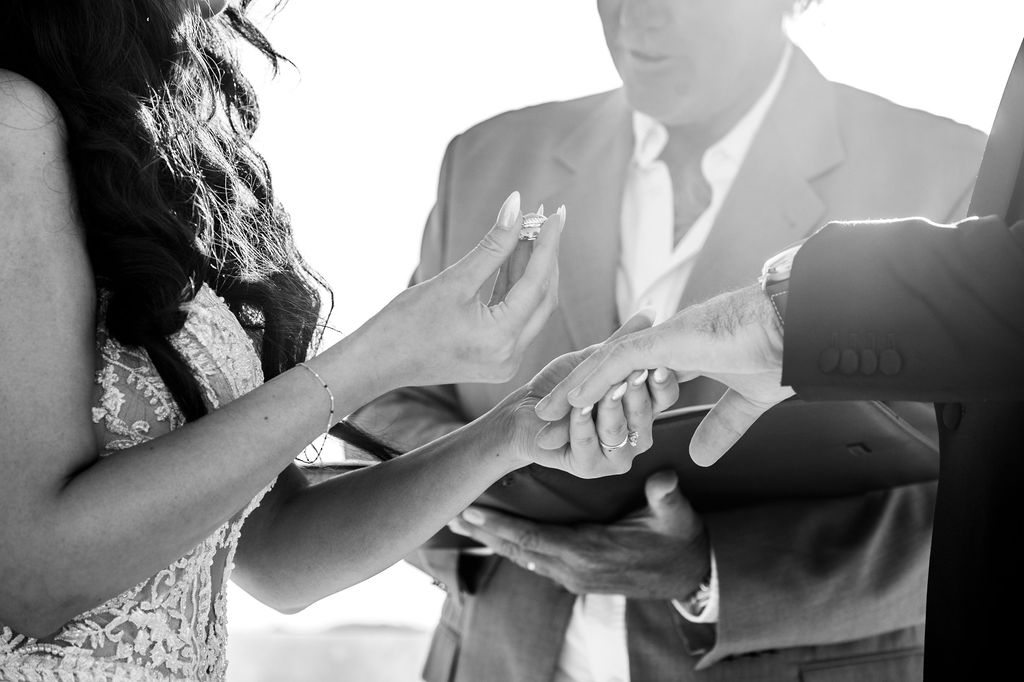 Ring exchange during wedding ceremony at Royal Myconian, Mykonos – DJ Seitan